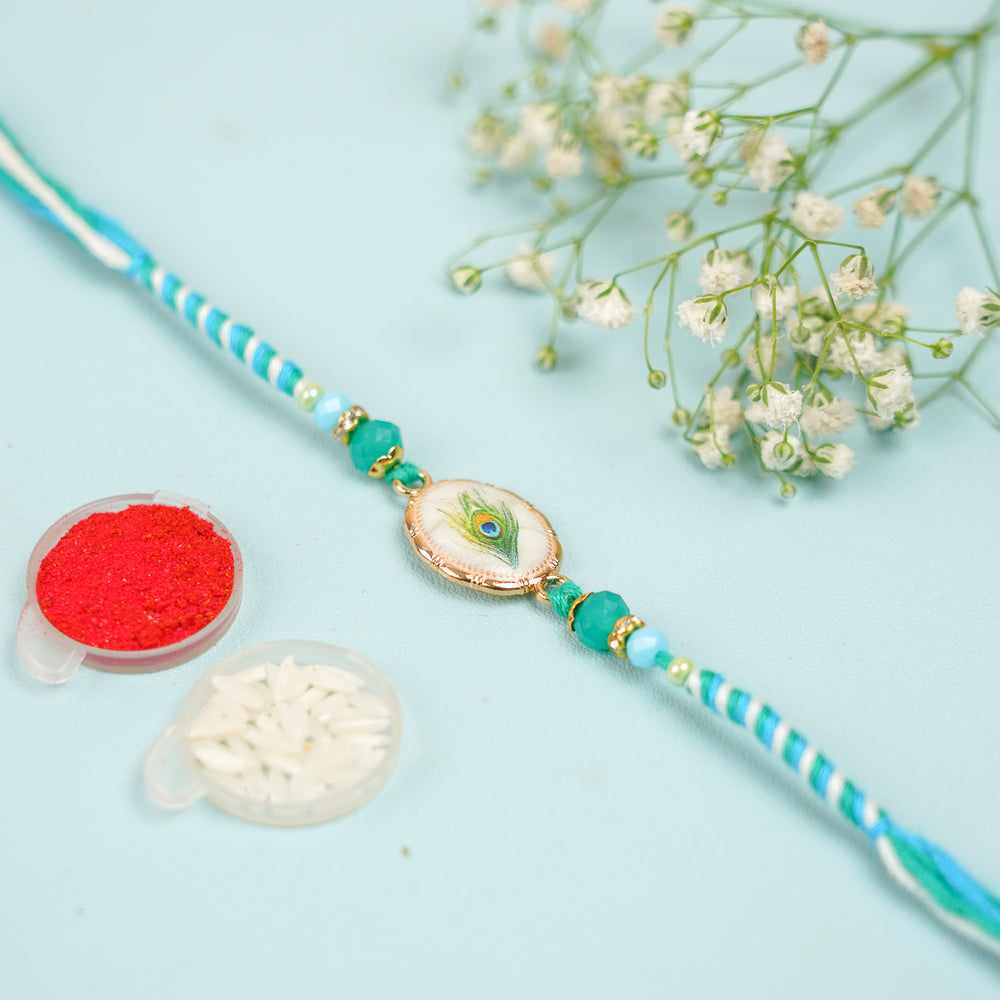Handmade Beaded Peacock Feather Theme Rakhi With Roli Chawal - Rakhi with Accessories Arrangement
