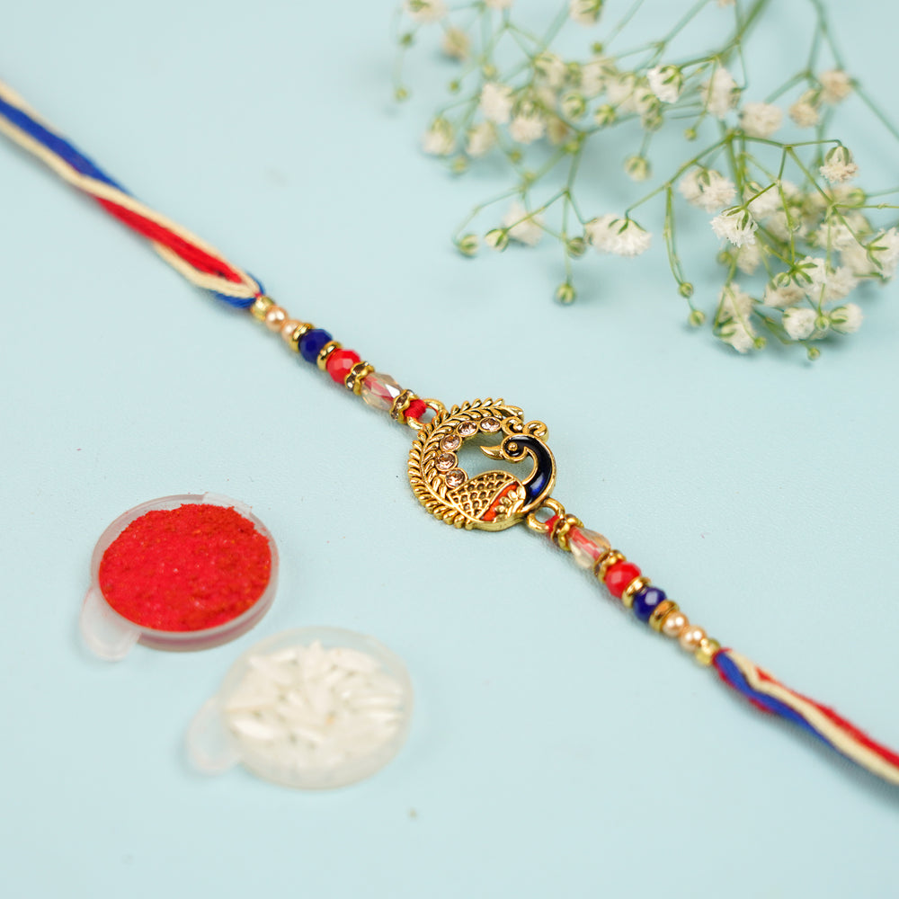 Handmade Blue And Red Peacock Jadtar Rakhi With Roli Chawal - Full product with accessories