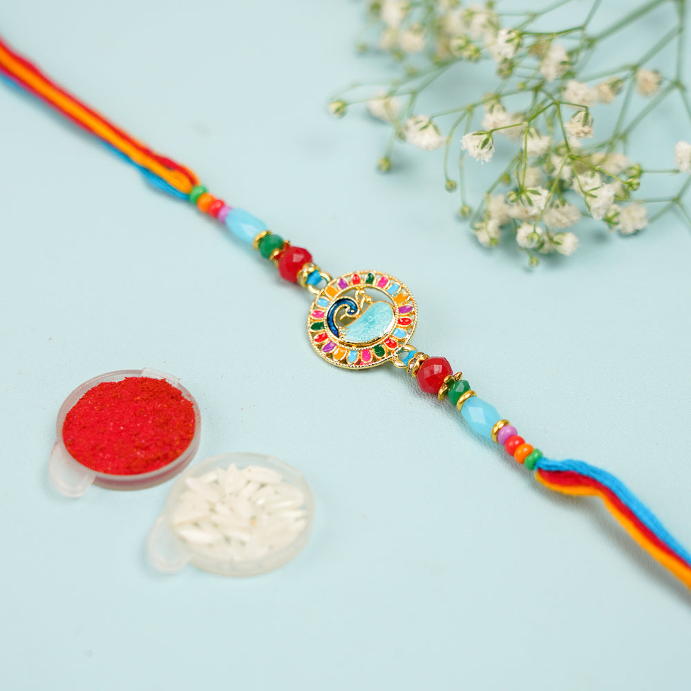 Handmade Multicolor Peacock Jadtar Rakhi With Roli Chawal - Shown with Traditional Accessories