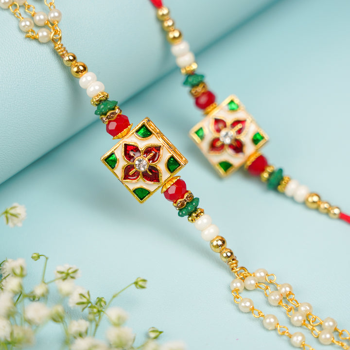 Handmade Square Jadtar And Pearl Bhaiya Bhabhi Rakhi With Roli Chawal Set Of 2 - Close-up of central embellishment