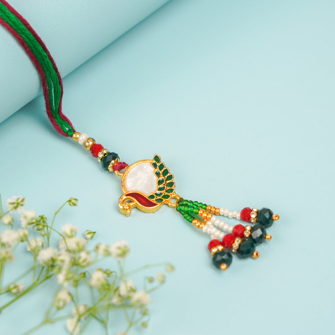 Handmade Beaded Peacock Bhaiya Bhabhi Rakhi With Roli Chawal Set Of 2 - Close-up of Decorative Pendant