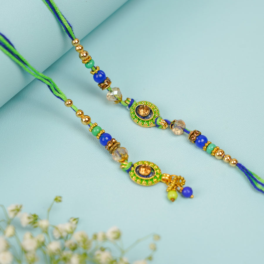 Handmade Beaded Green And Blue Bhaiya Bhabhi Rakhi With Roli Chawal Set Of 2 - Two Rakhis Displayed Together