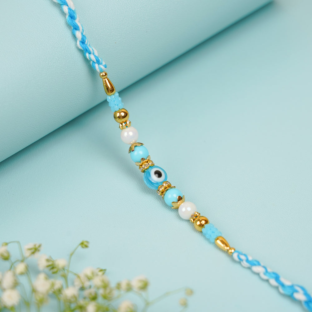 Handmade Beaded Blue Evil Eye Bhaiya Bhabhi Rakhi With Roli Chawal Set Of 2 - Single Bracelet Close-up