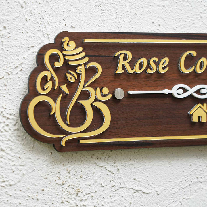 Personalized Weatherproof Brown And Gold Ganesh Themed Acrylic Name Plate - Close-up Side View on Wall
