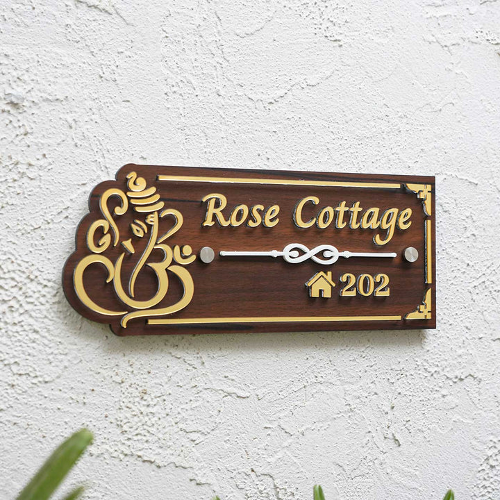 Personalized Weatherproof Brown And Gold Ganesh Themed Acrylic Name Plate - Mounted on Exterior Wall Angled View