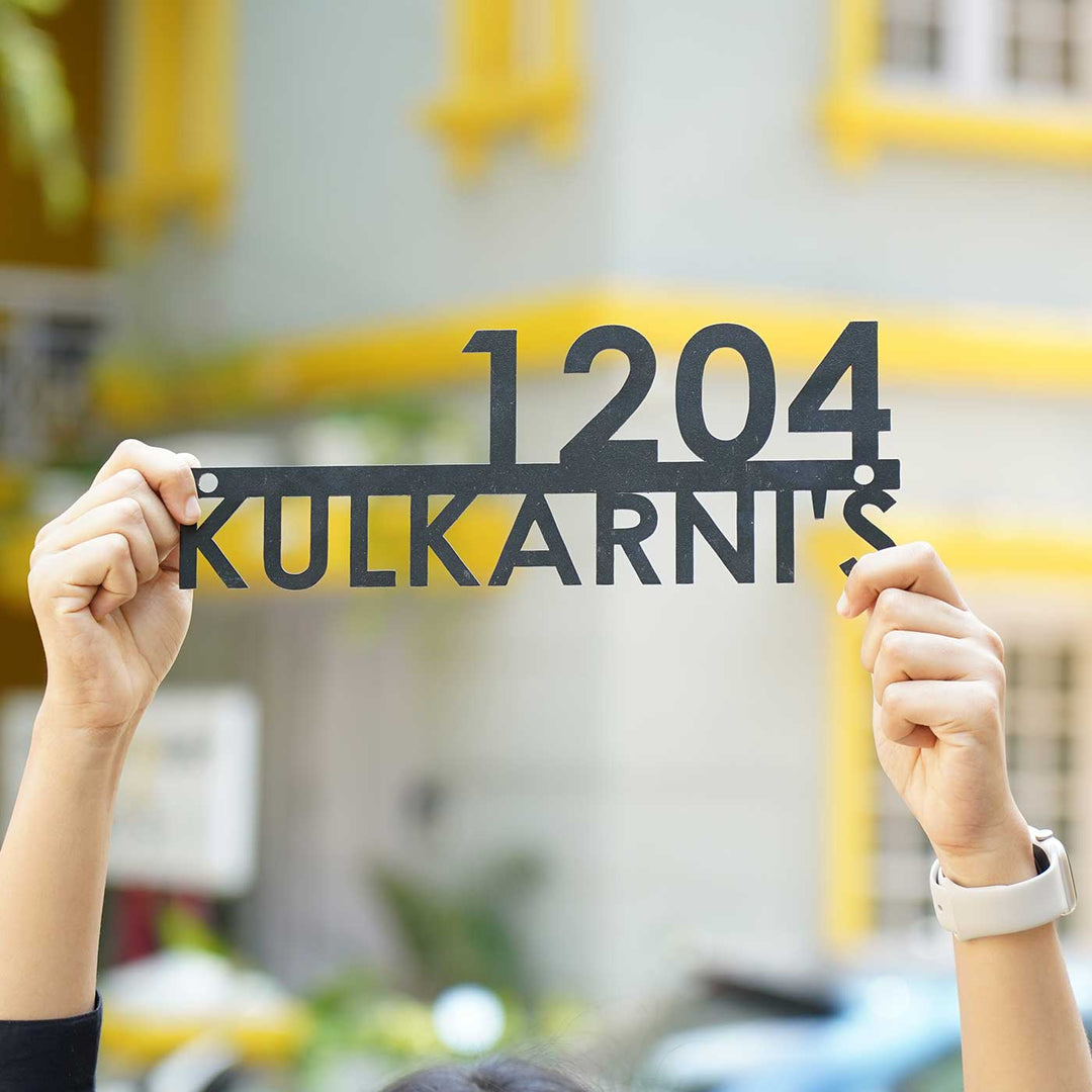 Personalized Modern Weatherproof Name Plate With House Number - Held in Hands Against Background