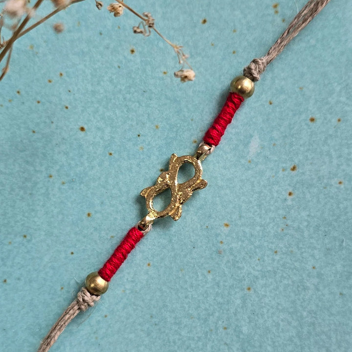 Handcrafted Infinity Brass Motif Rakhi With Roli Chawal For Brother