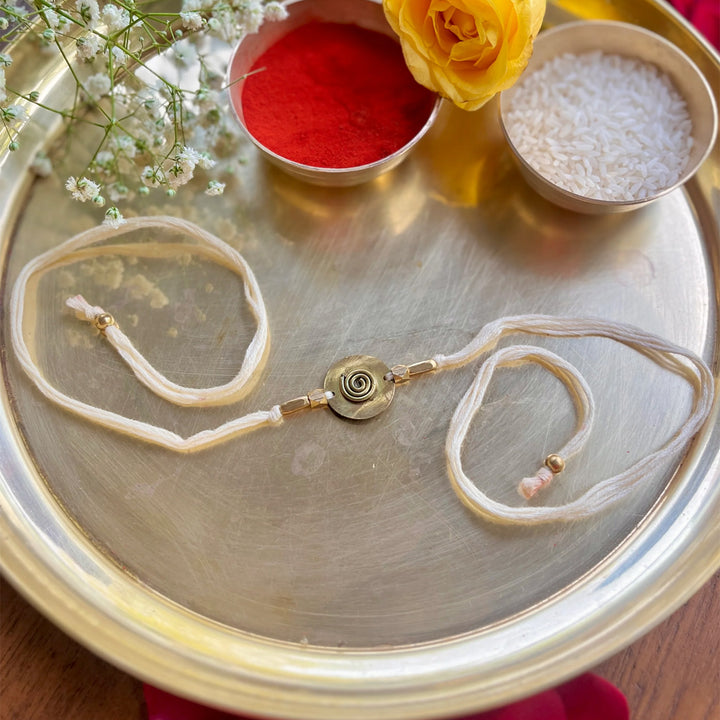 Handcrafted Spiral Brass Charm Rakhi With Roli Chawal For Brother