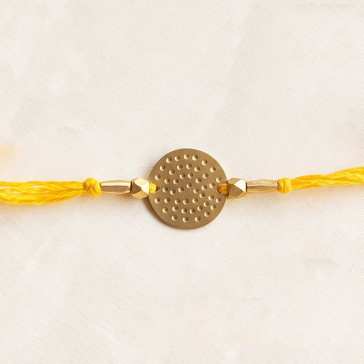Handcrafted Circular Hammered Brass Charm Rakhi With Roli Chawal For Brother