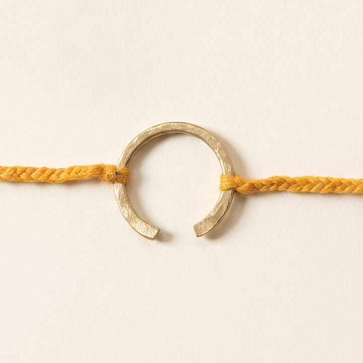 Handcrafted "Horse Shoe" Yellow Brass Rakhi With Roli Chawal For Brother