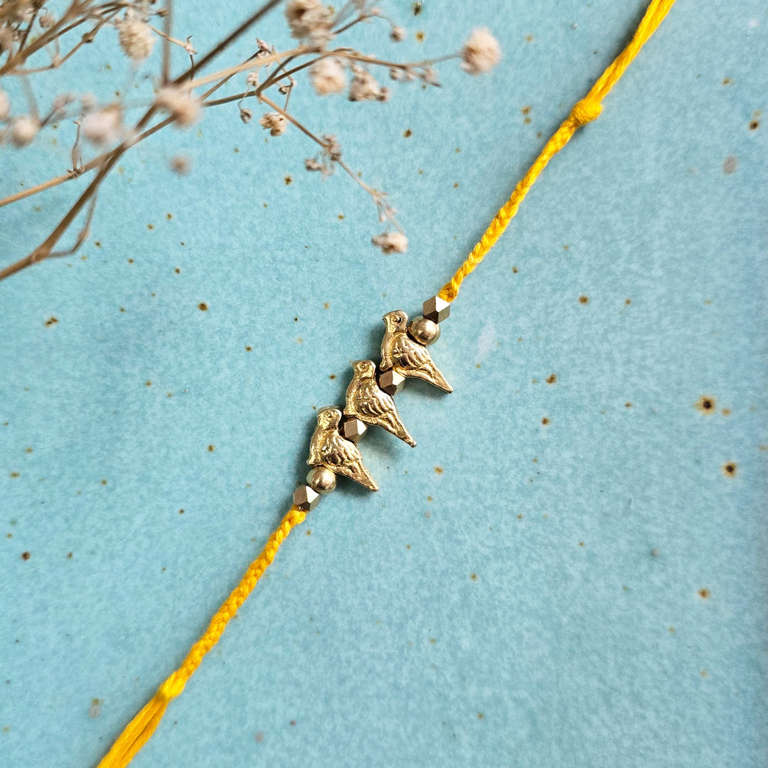 Handcrafted Brass Bird Rakhi With Roli Chawal For Sister