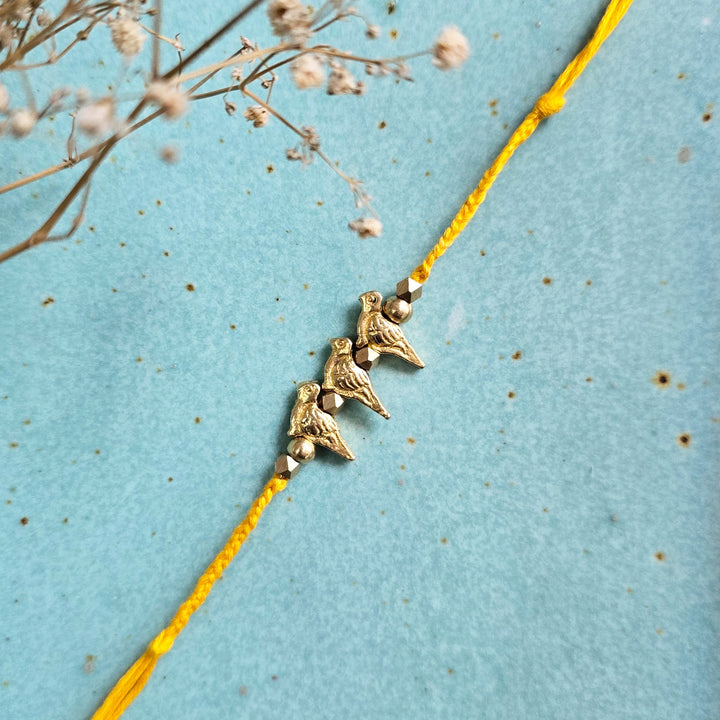 Handcrafted Brass Bird Rakhi With Roli Chawal For Sister