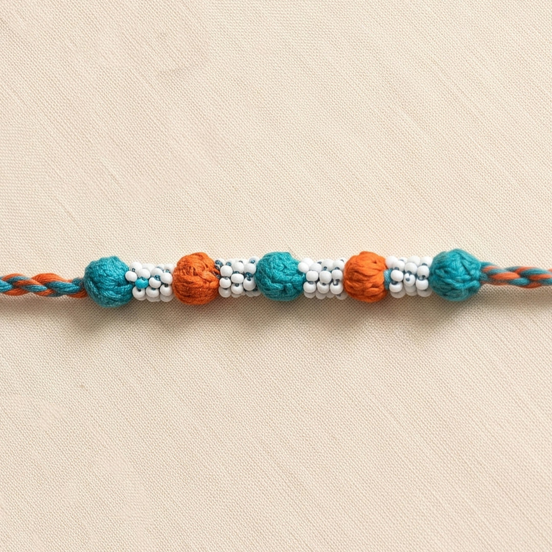Handmade Reusable Orange And Blue Beaded Patwa Rakhi For Brother