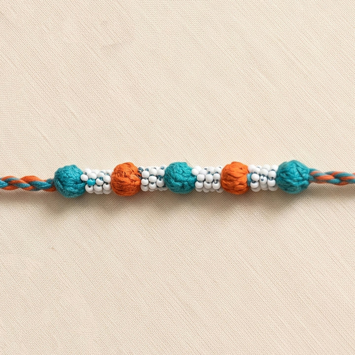 Handmade Reusable Orange And Blue Beaded Patwa Rakhi For Brother