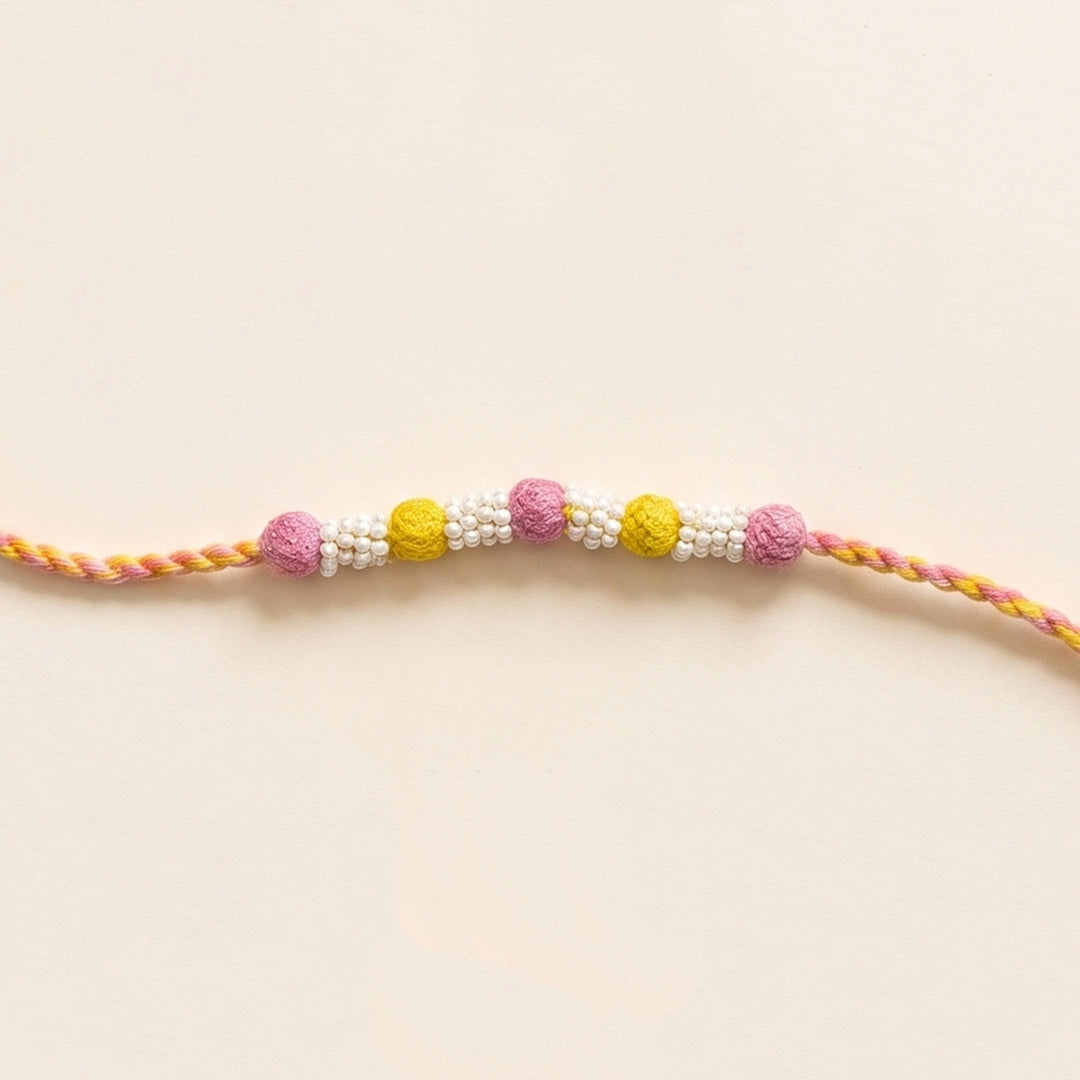 Handmade Reusable Light Pink And Yellow Beaded Patwa Rakhi For Brother
