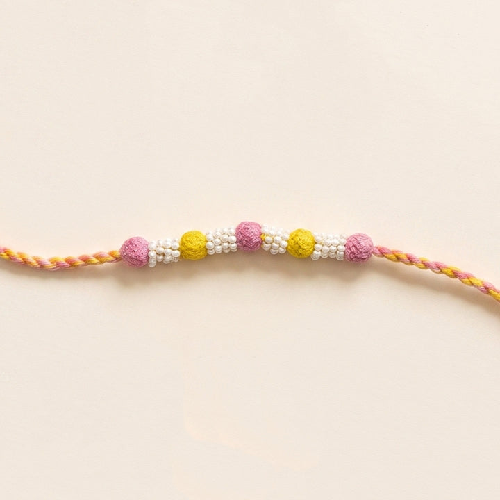 Handmade Reusable Light Pink And Yellow Beaded Patwa Rakhi For Brother