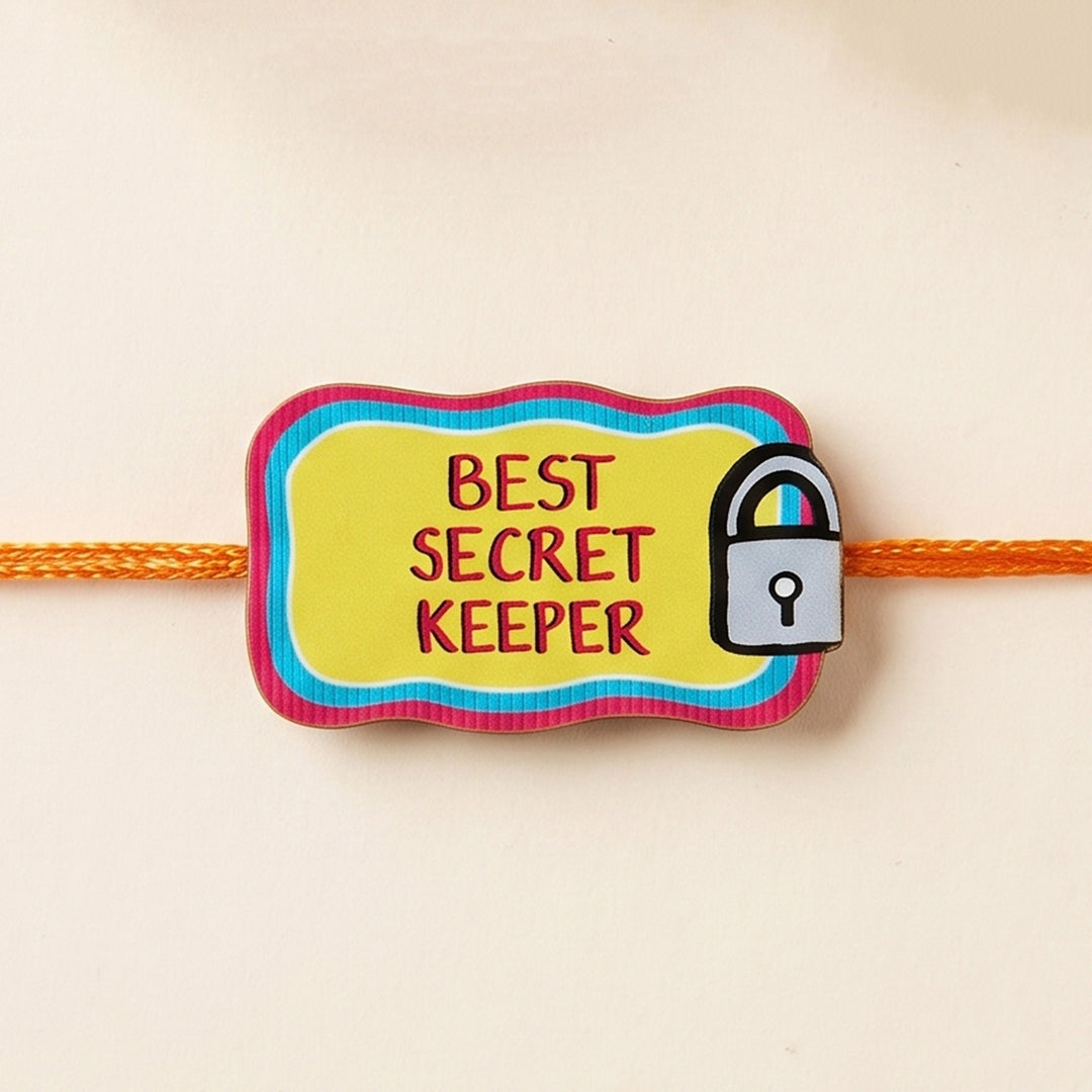 Glossy Printed Wooden 'Best Secret Keeper' Rakhi With Kumkum Rice For Brother