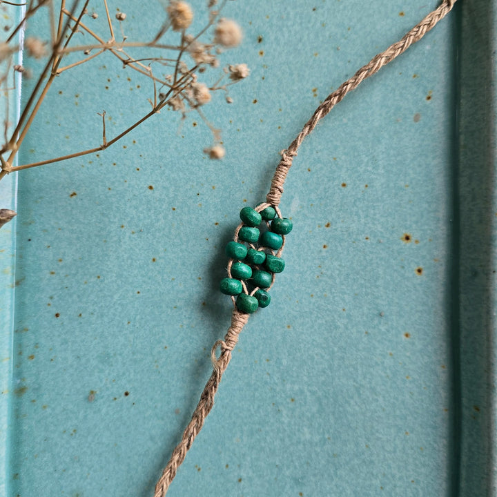 Handcrafted Jute Thread Teal Wood Bead Rakhi For Brother