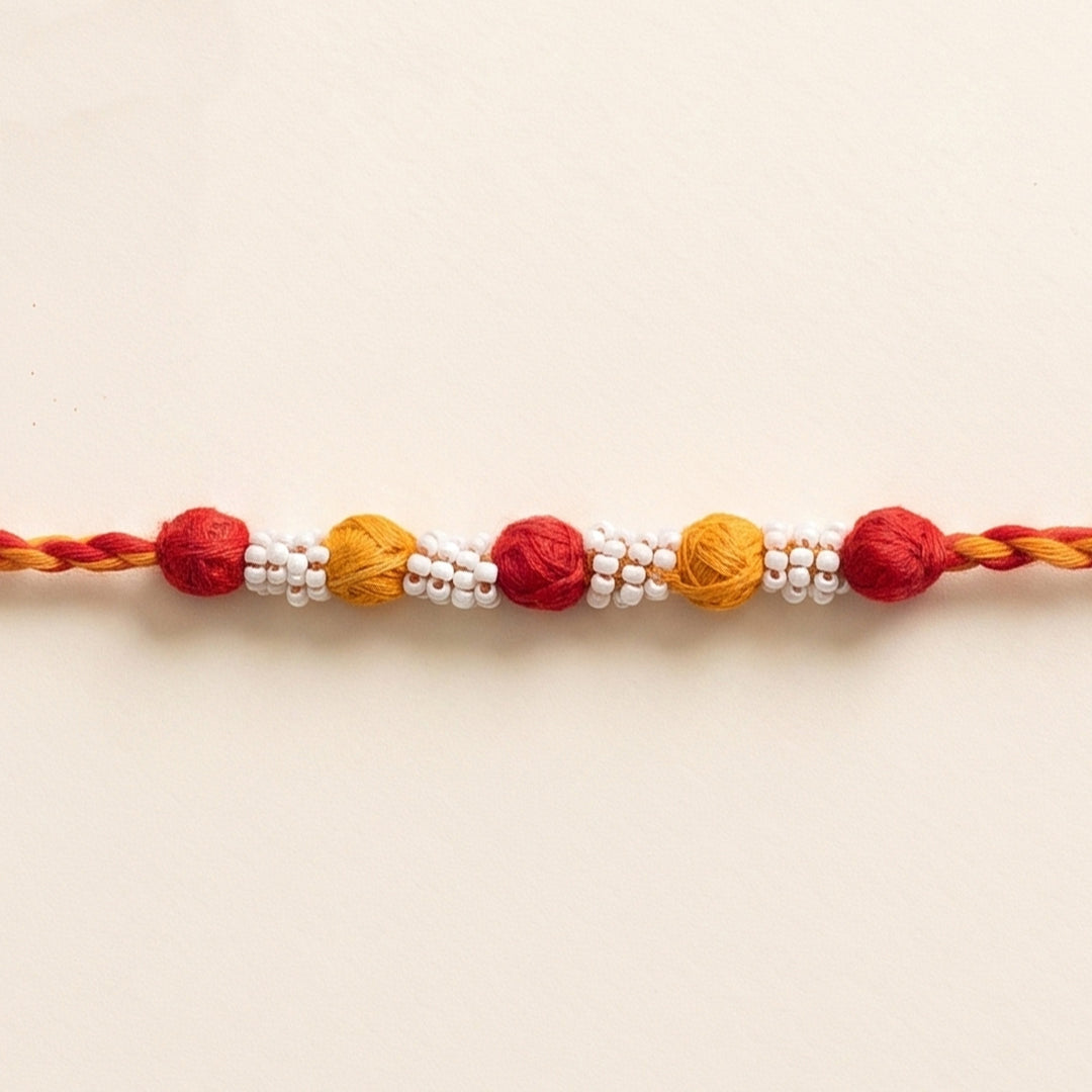 Handmade Reusable Red And Yellow Beaded Patwa Rakhi For Brother