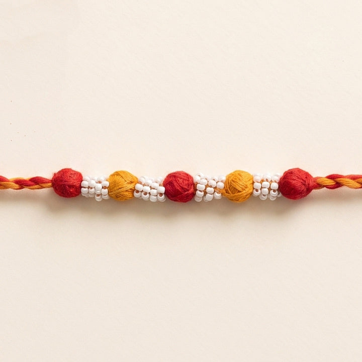 Handmade Reusable Red And Yellow Beaded Patwa Rakhi For Brother