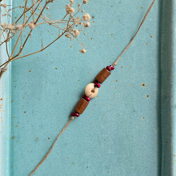 Handcrafted Jute Thread Brown & Beige Wood Bead Rakhi For Brother