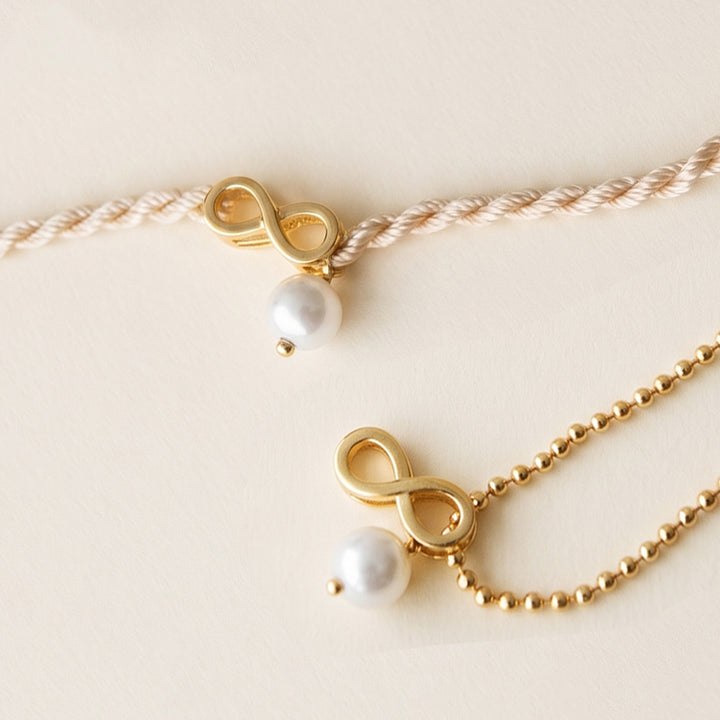 Infinity Love With Pearl Gold Plated Sterling Silver Rakhi & Lumba Set With Roli Chawal For Bhaiya Bhabhi | Set of 2