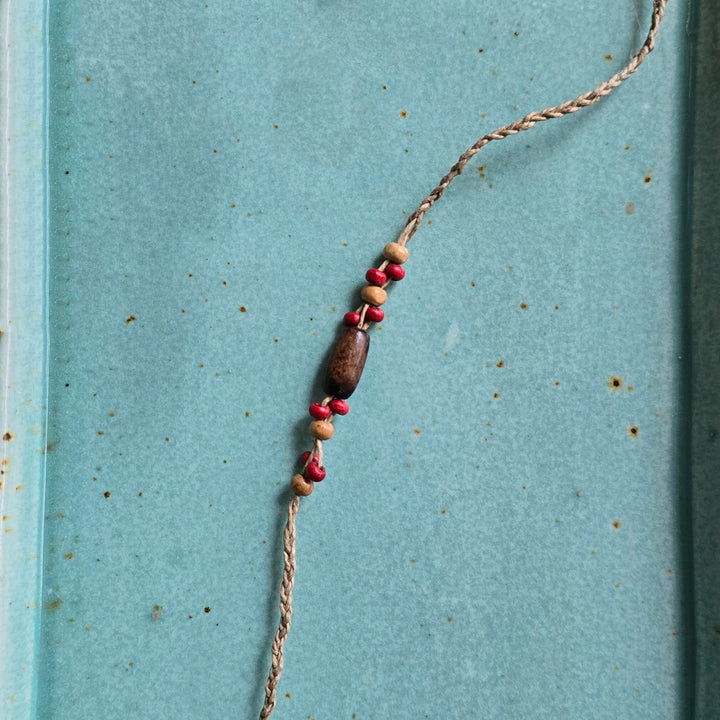 Handcrafted Jute Thread Brown & Red Wood Bead Rakhi For Brother