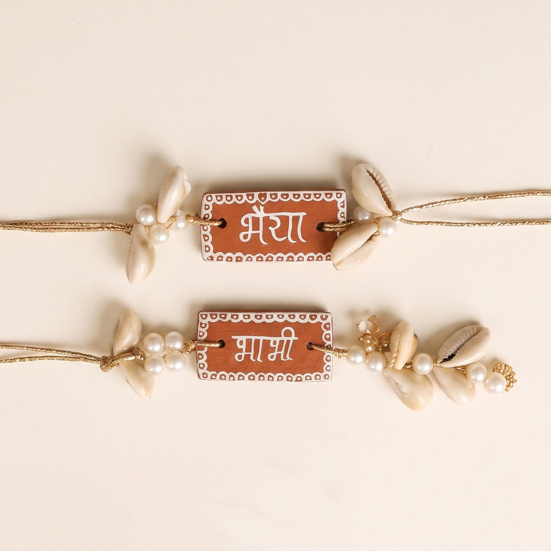 Personalized Name Terracotta Bhaiya Bhabhi Couple Rakhi With Roli Chawal | Set Of 2