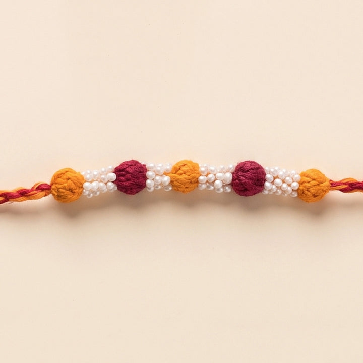 Handmade Reusable Maroon And Yellow Beaded Patwa Rakhi For Brother