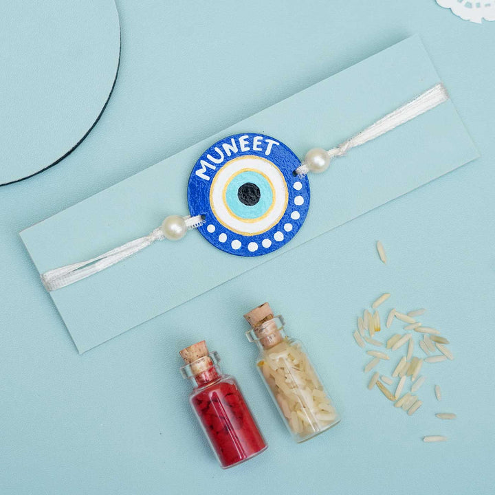 Personalized Hand-painted Evil Eye Themed Rakhi With Roli Chawal