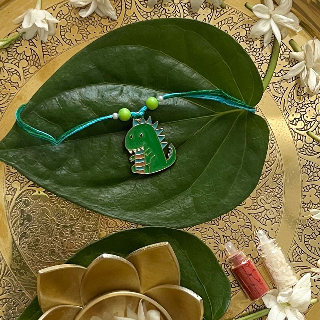 Engraved Little Dinosaur Enamel Metal Charm Rakhi With Roli Chawal for Brother
