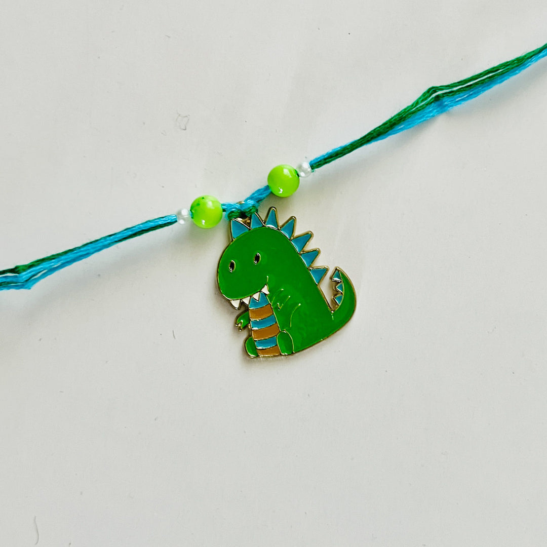 Engraved Little Dinosaur Enamel Metal Charm Rakhi With Roli Chawal for Brother