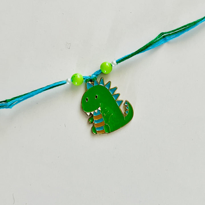 Engraved Little Dinosaur Enamel Metal Charm Rakhi With Roli Chawal for Brother
