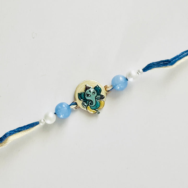 Engraved Lord Ganesha Enamel Metal Charm Rakhi With Roli Chawal for Brother