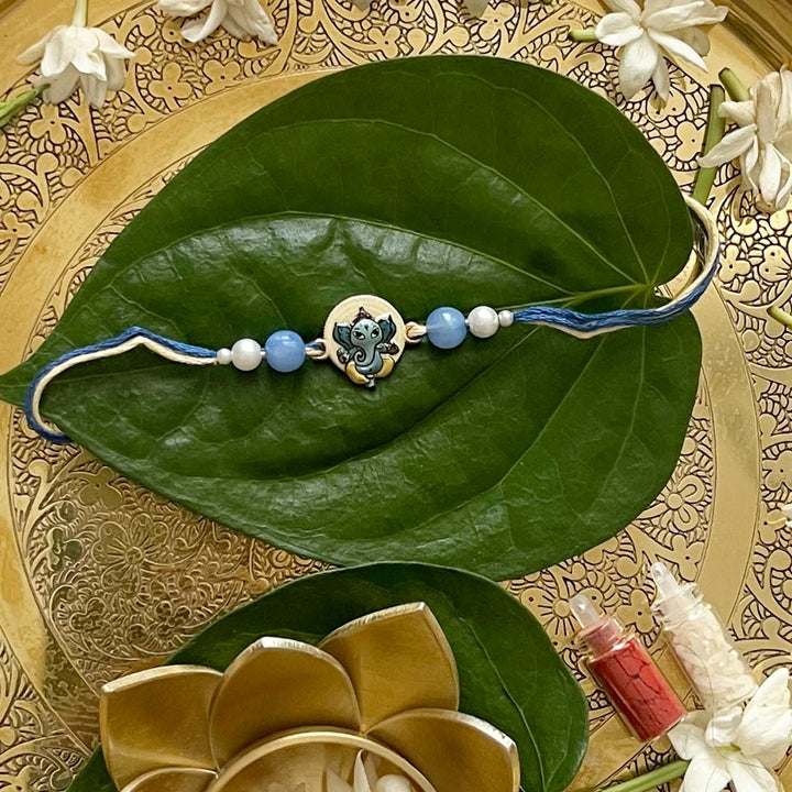 Engraved Lord Ganesha Enamel Metal Charm Rakhi With Roli Chawal for Brother