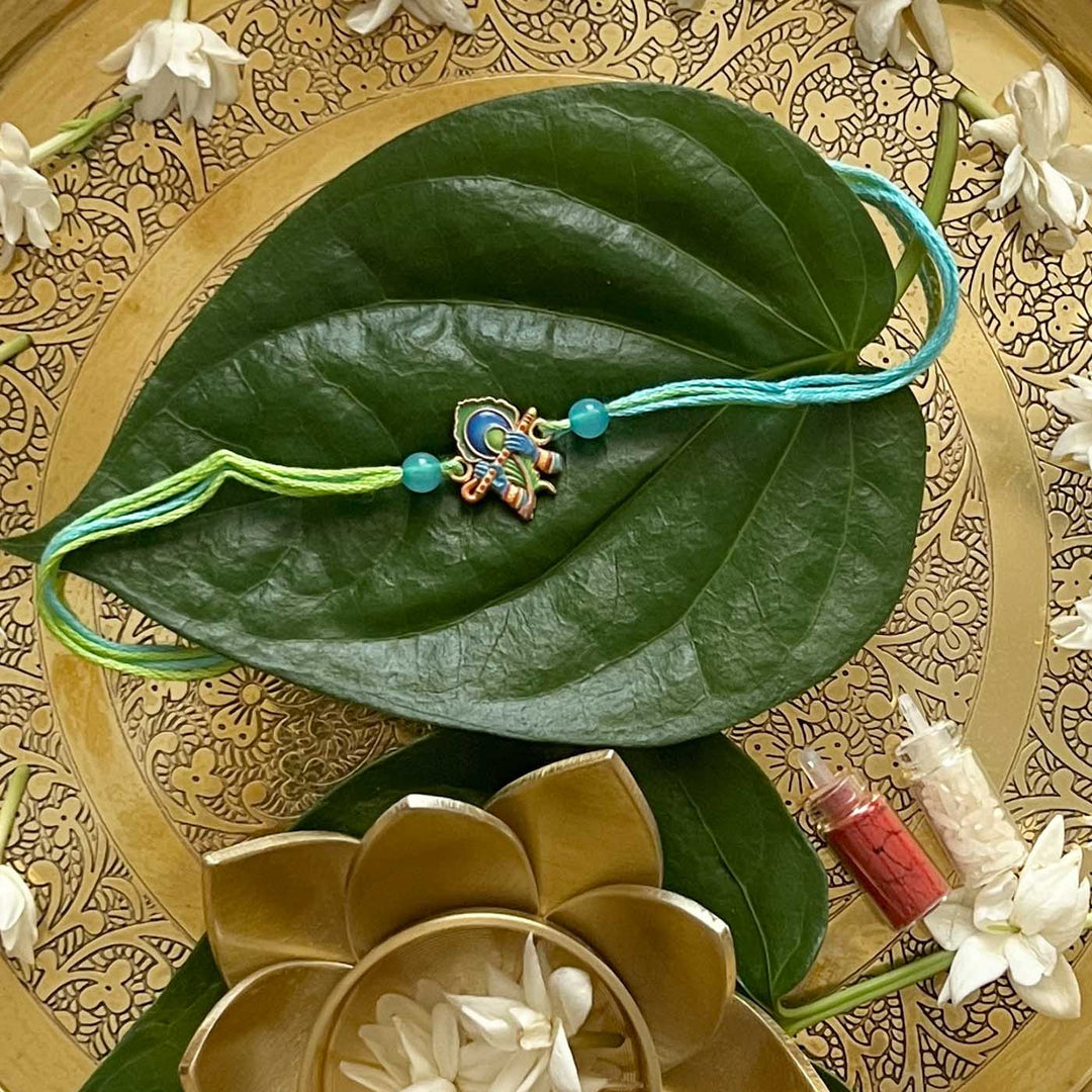 Engraved Lord Krishna Enamel Metal Charm Rakhi With Roli Chawal for Brother
