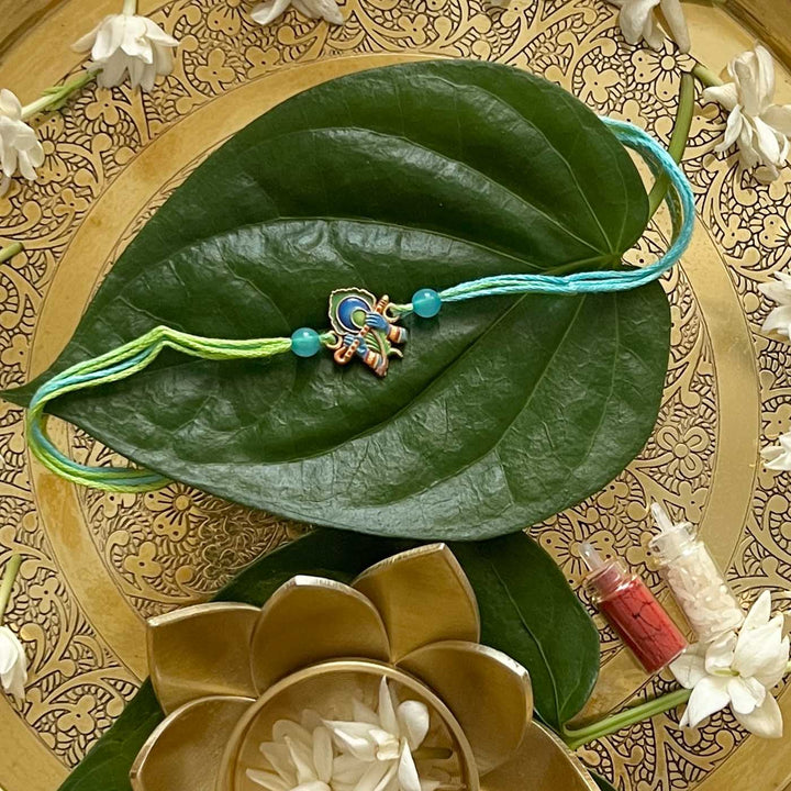 Engraved Lord Krishna Enamel Metal Charm Rakhi With Roli Chawal for Brother