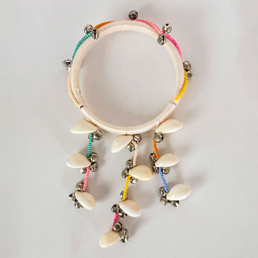 Handmade Beaded White Ghungroo And Shell Cotton Bangle Lumba With Roli Chawal For Bhabhi - Top View on Neutral Background