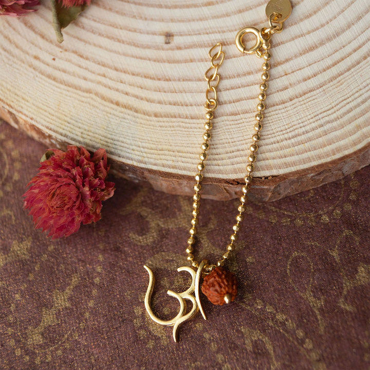 Sacred Om With Rudraksh Gold Plated Sterling Silver Rakhi & Lumba Set With Roli Chawal For Bhaiya Bhabhi | Set of 2
