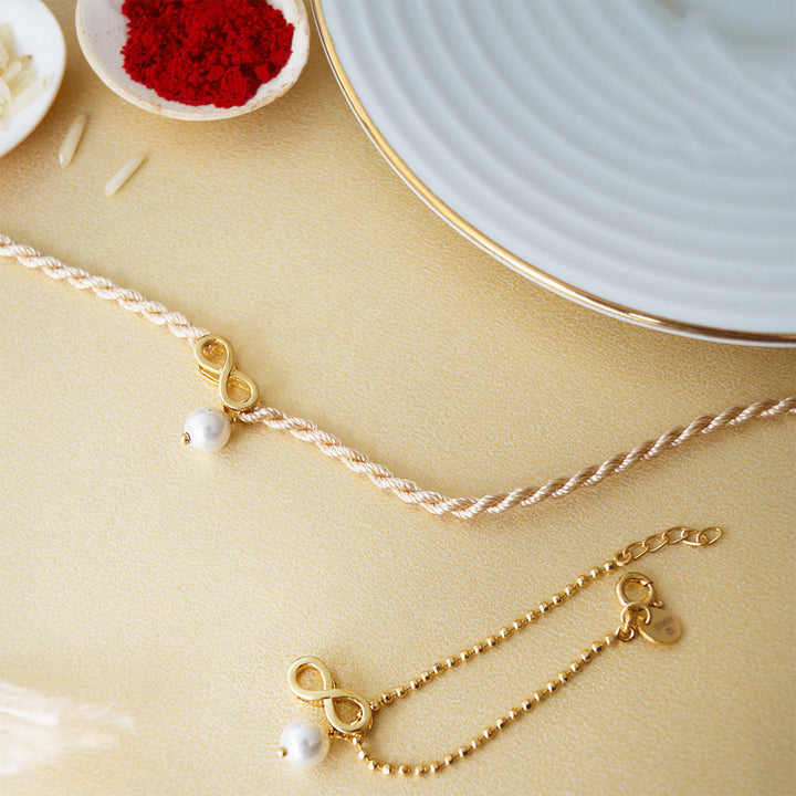 Infinity Love With Pearl Gold Plated Sterling Silver Rakhi & Lumba Set With Roli Chawal For Bhaiya Bhabhi | Set of 2