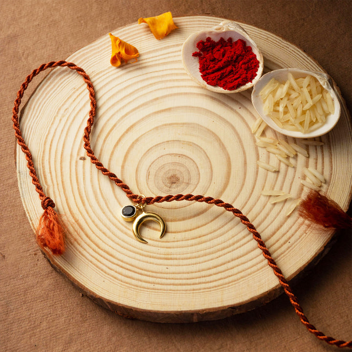 Holistic Charms Gold Plated Sterling Silver Rakhi & Lumba Set With Roli Chawal For Bhaiya Bhabhi | Set of 2