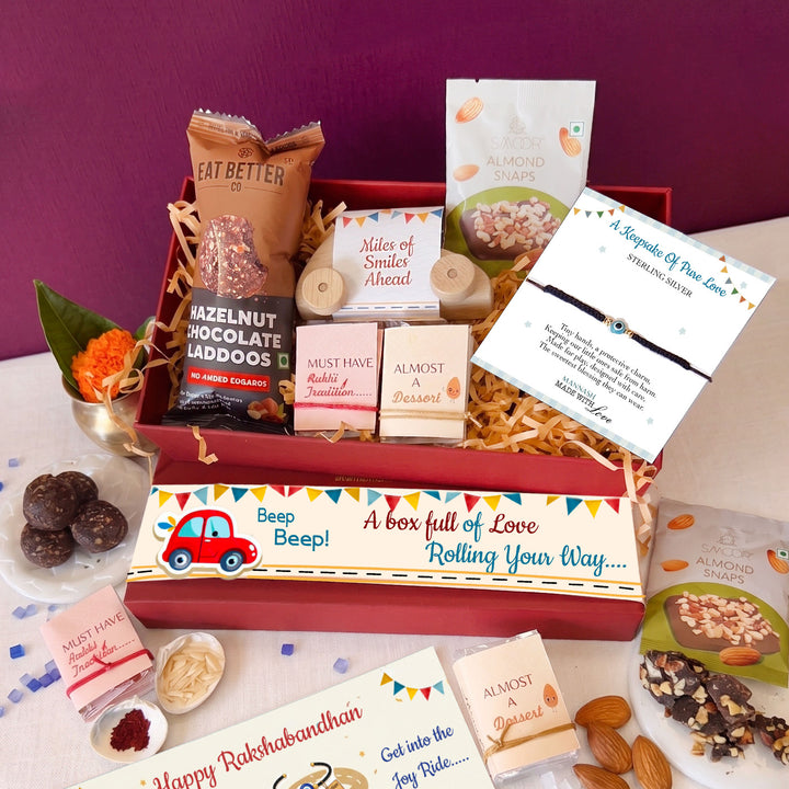 Joy Ride Evil Eye Nazariya Gold Plated Sterling Silver Rakhi Hamper With Toy Car, Chocolates & Roli Chawal For Baby Brother