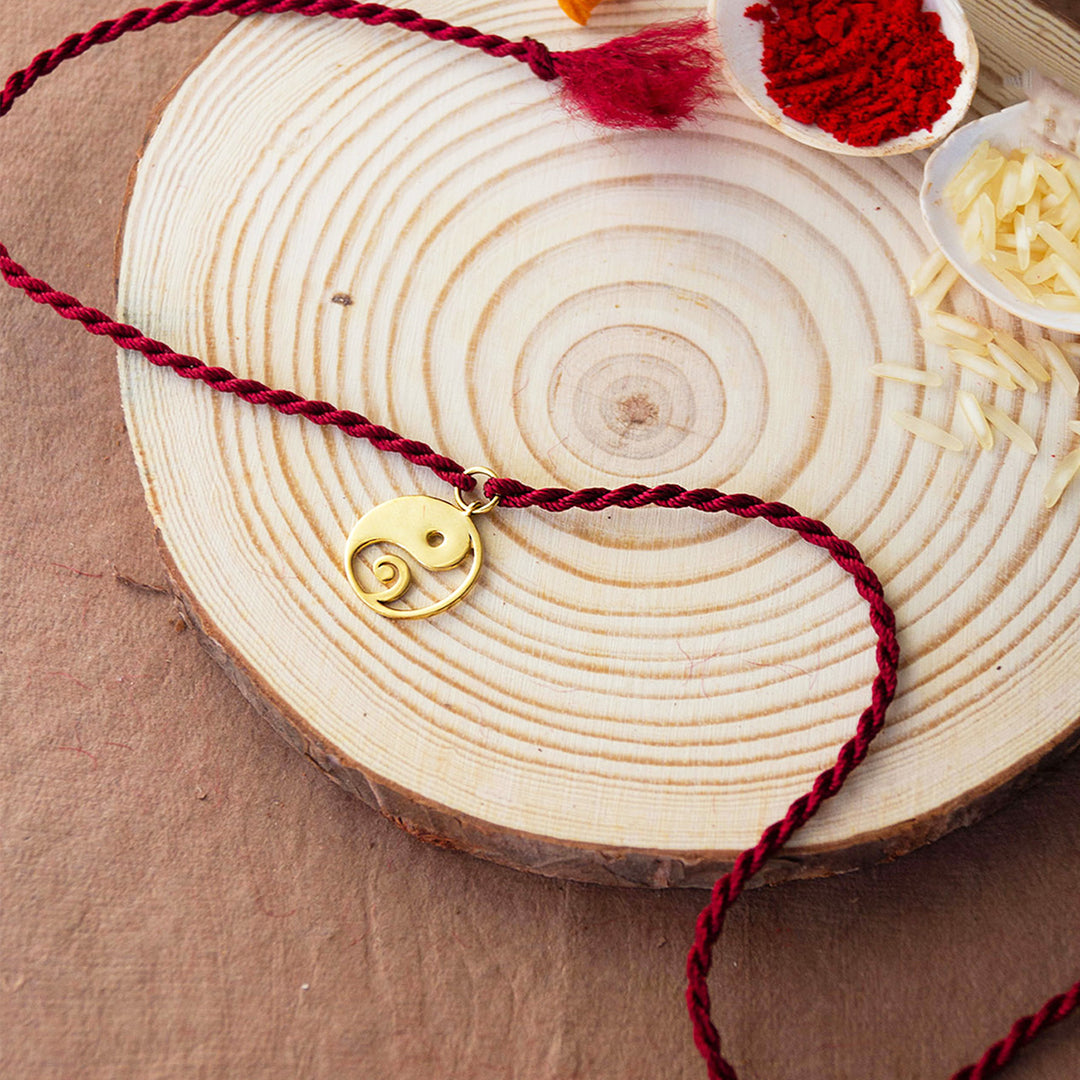 Yin And Yang With Ganesha Gold Plated Sterling Silver Charm Rakhi With Roli Chawal For Brother