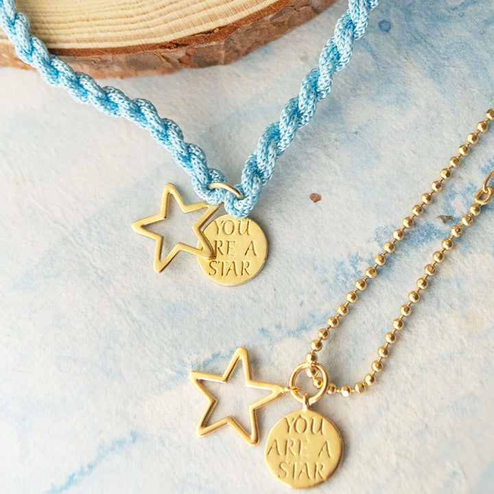 "You Are A Star" Gold Plated Sterling Silver Rakhi & Lumba Set With Roli Chawal For Bhaiya Bhabhi | Set of 2