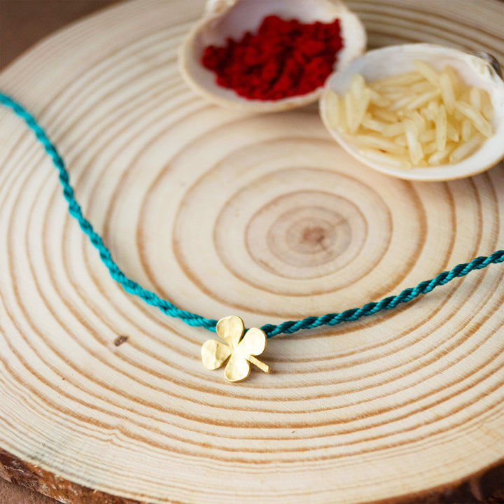Good Luck Clover Gold Plated Sterling Silver Rakhi & Lumba Set With Roli Chawal For Bhaiya Bhabhi | Set of 2