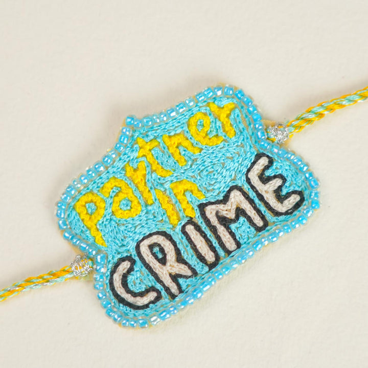 Handmade Beaded Partner In Crime Theme Rakhi With Roli Chawal For Brother