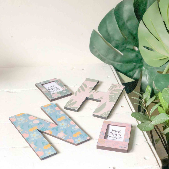 Printed Monogram Desk Initial With Polaroid Photo Frame - Flat Lay Display Showing Multiple Items