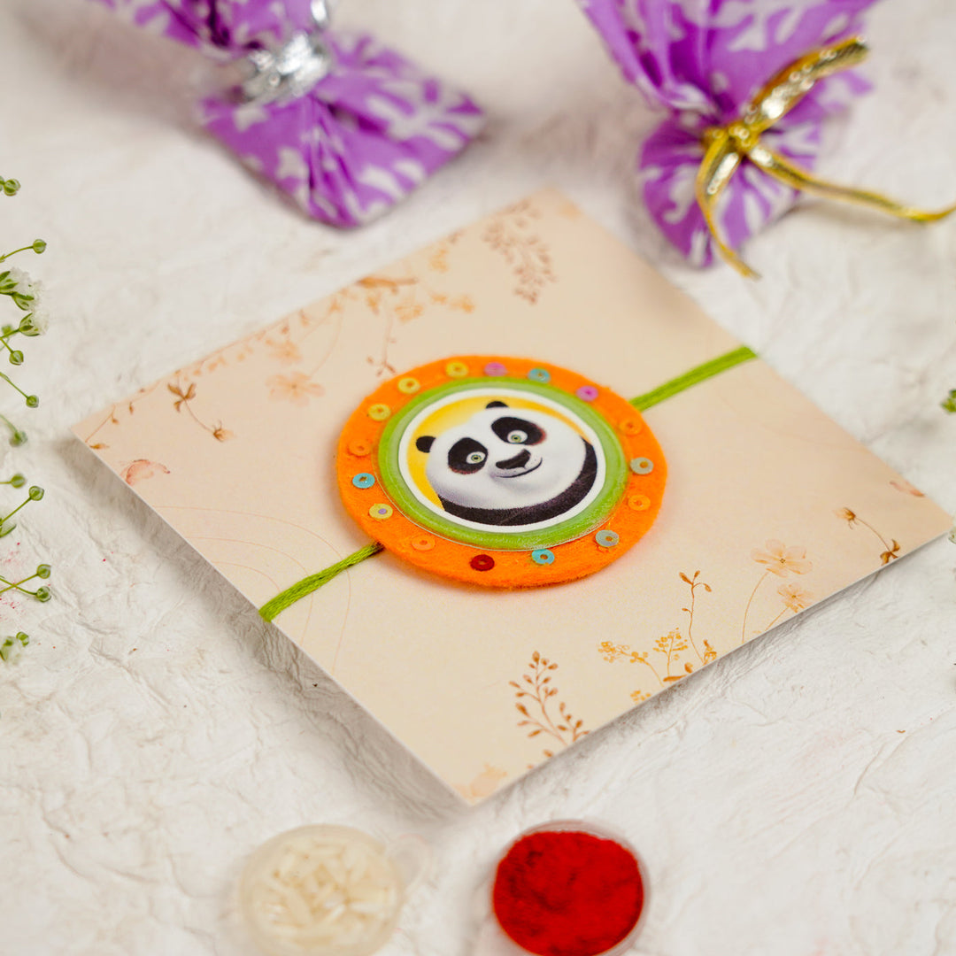 Handmade Kung Fu Panda Kids Rakhi With Roli Chawal - Angled View on Packaging (9)