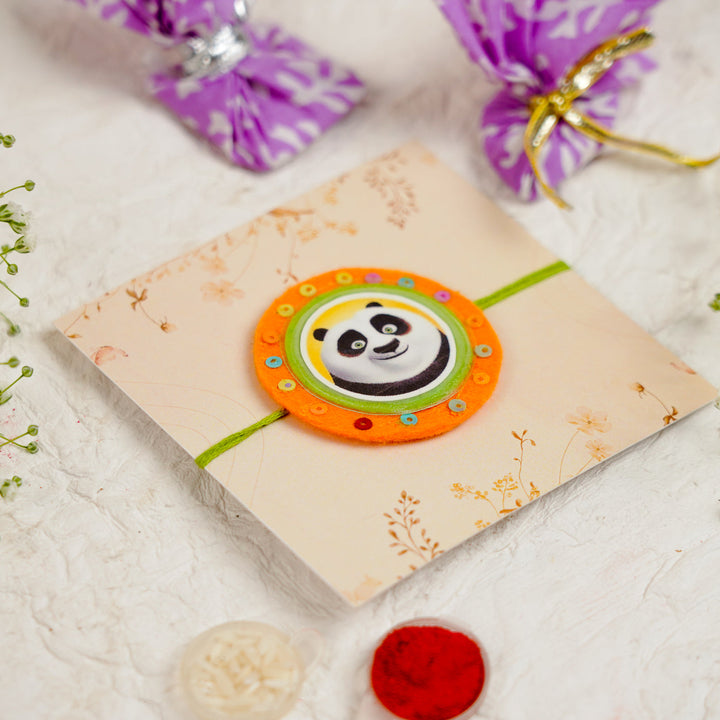 Handmade Kung Fu Panda Kids Rakhi With Roli Chawal - Angled View on Packaging (9)