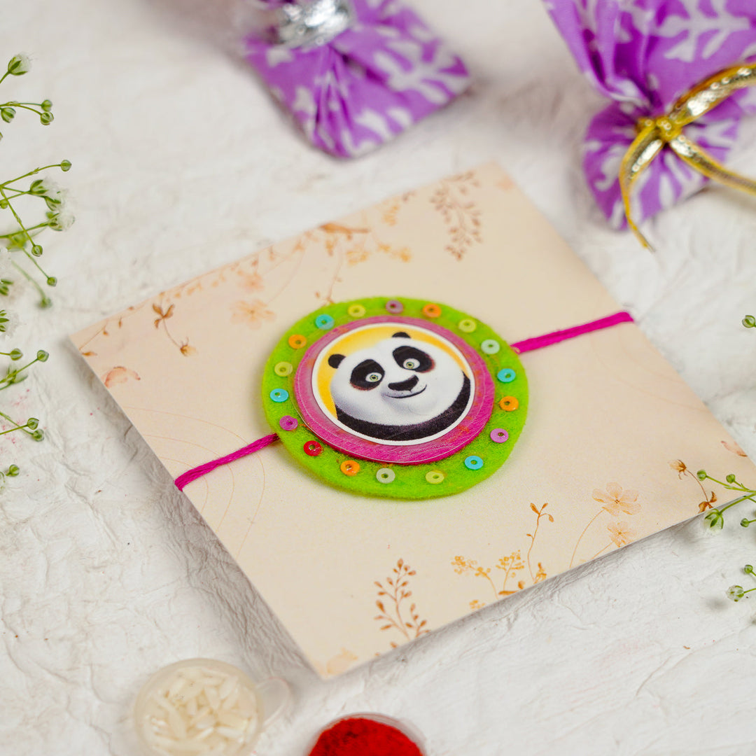 Handmade Kung Fu Panda Kids Rakhi With Roli Chawal - Angled View on Packaging (6)